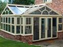Cream PVC-u conservatory with cart wheel gable