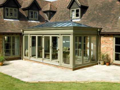 Green fascia orangery with full height glass