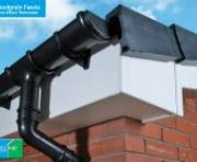 White woodgrain roof-line with round gutter